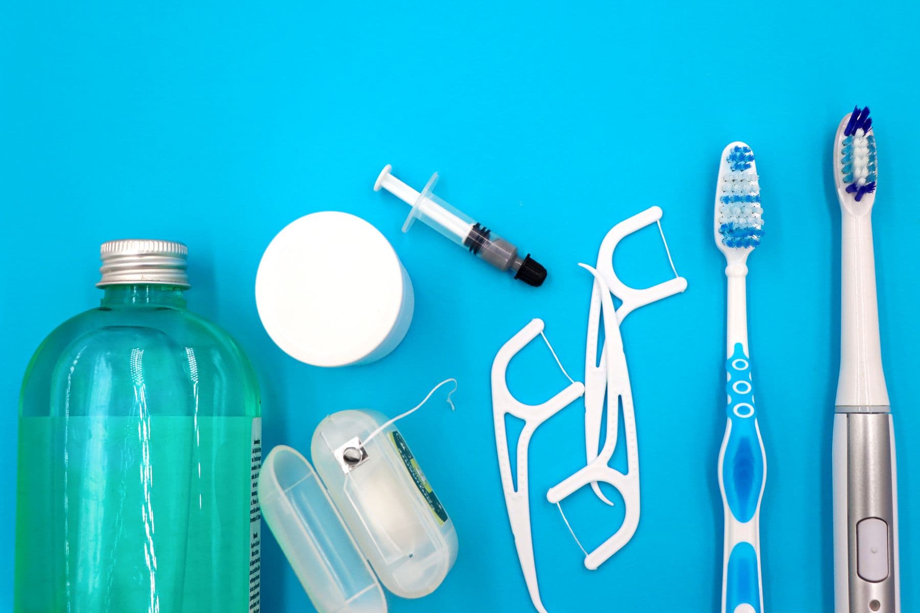 Oral care products on a blue background